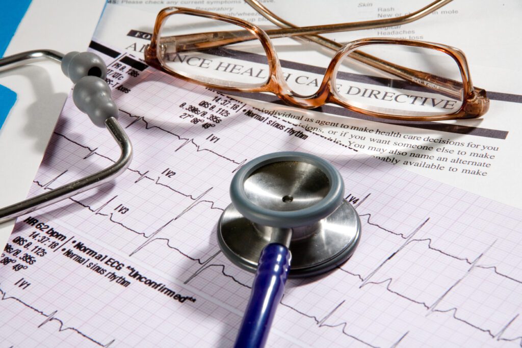 Advance healthcare directive document with a stethoscope and medical charts
