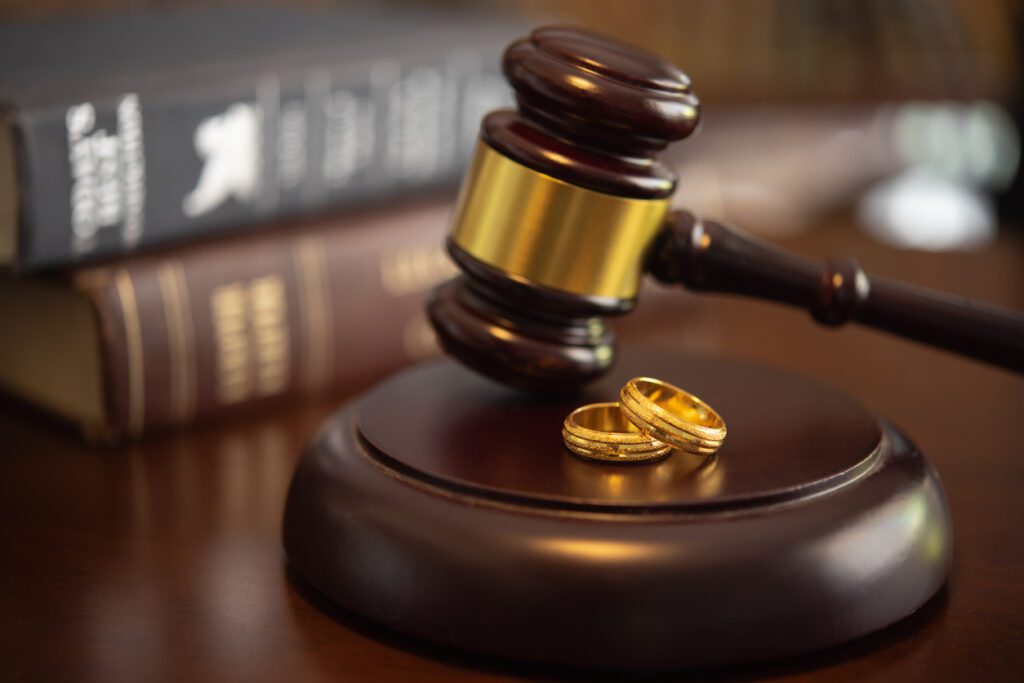 a gavel with wedding bands to represent family law